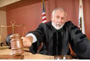 stock photo : Older, distinguished judge making his ruling in the courtroom