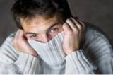 stock photo : Man hiding his face in sweater.